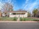 Cozy one-story house with a fenced front yard, perfect for a starter home at 7881 Kenwood St, Commerce City, CO 80022