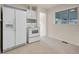 Clean kitchen with white appliances and ample cabinet space at 7881 Kenwood St, Commerce City, CO 80022