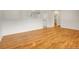 Spacious living area featuring hardwood floors and a view to the kitchen at 7881 Kenwood St, Commerce City, CO 80022