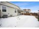 Spacious backyard with a covered patio and partial fence, perfect for outdoor entertaining and relaxation at 9777 W Stanford Ave, Denver, CO 80123