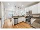 Stylish kitchen with stainless steel appliances and granite countertops at 9777 W Stanford Ave, Denver, CO 80123