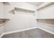 Walk-in closet with carpet and white shelving at 9777 W Stanford Ave, Denver, CO 80123