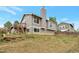 Exterior shot of the backyard with a view of the home's upper level, showcasing the exterior features at 18950 E Kent Cir, Aurora, CO 80013