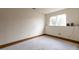 Unfinished basement space with a large window, ready for customization and expansion at 18950 E Kent Cir, Aurora, CO 80013