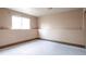Unfinished basement space with a large window, ready for customization and expansion at 18950 E Kent Cir, Aurora, CO 80013