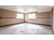 Unfinished basement space with a large window, ready for customization and expansion at 18950 E Kent Cir, Aurora, CO 80013