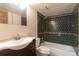 Full bathroom features a tiled shower and tub combo, plus a pedestal sink vanity at 18950 E Kent Cir, Aurora, CO 80013