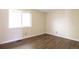 Bright bedroom featuring modern floors and a large window for plenty of natural light at 18950 E Kent Cir, Aurora, CO 80013