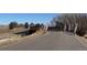 Bridge over a river in a community featuring a paved path for pedestrians and cyclists at 42968 Colonial Trl, Elizabeth, CO 80107