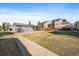View of the backyard featuring a well-maintained lawn and patio at 6011 Yarrow St # C, Arvada, CO 80004
