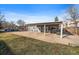 Well-maintained backyard featuring a covered patio and parking for several vehicles at 6011 Yarrow St # C, Arvada, CO 80004