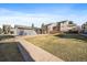 Spacious backyard offering a covered patio and ample green space for outdoor enjoyment at 6011 Yarrow St # C, Arvada, CO 80004