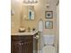 Cozy bathroom with a vanity, toilet and a mirror at 6011 Yarrow St # C, Arvada, CO 80004