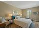 Serene bedroom with hardwood floors offers a peaceful retreat, enhanced by ample natural light at 6011 Yarrow St # C, Arvada, CO 80004