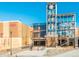 Exterior view of the town hub with a clock tower and modern architectural design at 6011 Yarrow St # C, Arvada, CO 80004