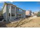 Spacious backyard featuring a patio area, pergola, and well-maintained lawn, ideal for outdoor enjoyment at 22668 E Lake Pl, Centennial, CO 80015