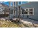 Backyard patio with seating, potted plants, and a pergola, offering a comfortable outdoor living space at 22668 E Lake Pl, Centennial, CO 80015