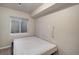 Cozy bedroom space with a window and minimalist decor, creating a serene and inviting atmosphere at 22668 E Lake Pl, Centennial, CO 80015
