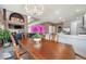This spacious dining room features an ornate table, opening to the living room and kitchen at 22668 E Lake Pl, Centennial, CO 80015