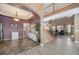 Open-concept design with tile floors, staircase, and view of the living room creating a seamless flow at 22668 E Lake Pl, Centennial, CO 80015