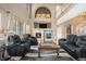 Inviting living room with a cozy fireplace, comfortable seating, and a decorative mantel, ideal for gatherings at 22668 E Lake Pl, Centennial, CO 80015