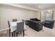 Comfortable living area with a dining table and chairs, perfect for intimate gatherings at 22668 E Lake Pl, Centennial, CO 80015