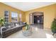 Inviting living room with a cozy sofa, stylish gold table, and open access to other areas at 22668 E Lake Pl, Centennial, CO 80015