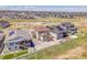 Bird's eye view showcases luxury homes and community, complemented by lush green spaces and walking trails at 6880 S Yantley Ct, Aurora, CO 80016