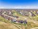 Expansive aerial view of a residential community featuring manicured landscaping and attractive single-Gathering homes at 6880 S Yantley Ct, Aurora, CO 80016
