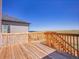Wooden deck with a railing, offering a view of the landscape, perfect for relaxing and outdoor enjoyment at 6880 S Yantley Ct, Aurora, CO 80016