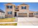 Inviting two-story home featuring neutral siding, a three-car garage, and a well-manicured front lawn at 6880 S Yantley Ct, Aurora, CO 80016