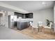 Stylish kitchen with stainless steel appliances, granite countertops, and a dining area for casual meals at 6880 S Yantley Ct, Aurora, CO 80016