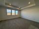 Bright bedroom with carpet flooring and three windows at 2904 S Poppy St, Morrison, CO 80465