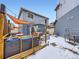 Backyard area features deck, patio, seating, hot tub, and grill at 17950 E 54Th Ave, Denver, CO 80249