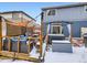 Backyard patio and deck feature seating, a hot tub and sunshades at 17950 E 54Th Ave, Denver, CO 80249