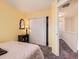 Bright bedroom with closet, and access to the hallway at 17950 E 54Th Ave, Denver, CO 80249