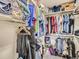 Walk-in closet offers plentiful storage with organized shelving and hanging space for all your wardrobe needs at 17950 E 54Th Ave, Denver, CO 80249