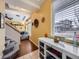 Bright foyer featuring a staircase, white console table, and view to the living room at 17950 E 54Th Ave, Denver, CO 80249