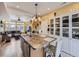 Open concept kitchen with island seating and pendant lights flows into the adjacent living room at 17950 E 54Th Ave, Denver, CO 80249