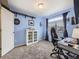 Bright home office with large window, shelving and a neutral color palette at 17950 E 54Th Ave, Denver, CO 80249