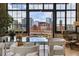 View from the dining room to the private outdoor balcony with city views at 2000 Little Raven St # 4A, Denver, CO 80202
