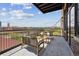 Relaxing outdoor balcony space with seating and views of the city skyline at 2000 Little Raven St # 4A, Denver, CO 80202