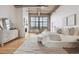 Bright bedroom with exposed concrete ceiling, large windows, fireplace, and hardwood flooring at 2000 Little Raven St # 4A, Denver, CO 80202