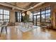 Bright dining room with floor to ceiling windows, concrete ceilings, and city views at 2000 Little Raven St # 4A, Denver, CO 80202