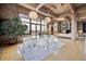 Dining area featuring oversized windows, decorative tree, and modern sphere hanging lights above the table at 2000 Little Raven St # 4A, Denver, CO 80202