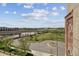 Exterior shot with a beautiful park view and blue sky with white clouds in the background at 2000 Little Raven St # 4A, Denver, CO 80202