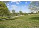Community grounds featuring a walking path with mature trees and green spaces at 2000 Little Raven St # 4A, Denver, CO 80202