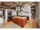 Modern kitchen with stainless steel appliances, island and custom cabinetry at 2000 Little Raven St # 4A, Denver, CO 80202