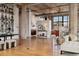 Spacious open-concept living space featuring hardwood floors, modern lighting, and a dining area at 2000 Little Raven St # 4A, Denver, CO 80202