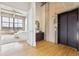 Bright living room showcases hardwood floors, large windows and an open doorway to the bedroom at 2000 Little Raven St # 4A, Denver, CO 80202